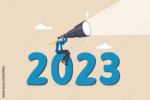 Year 2023 outlook, business opportunity or new challenge ahead, vision to make decision or move forward, plan and perspective concept, confidence businessman look through telescope on year 2023.