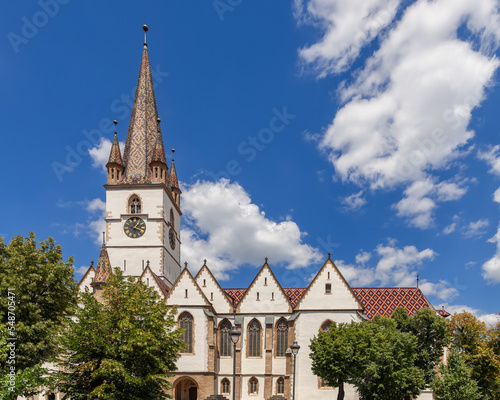 Fototapeta Naklejka Na Ścianę i Meble -  Lutheran Cathedral of Saint Mary (Biserica Evanghelica din Sibiu) with Its massive 73 m high steeple is the most famous Gothic-style church in Sibiu, Transylvania, Romania