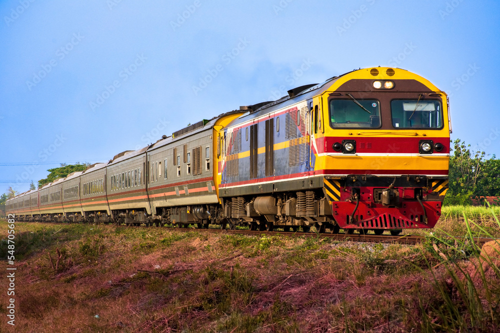 Passenger train by diesel locomotive on the railway. Passenger train by diesel locomotive on the railway.