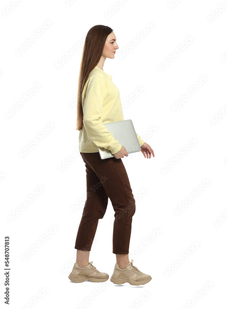 Young woman with laptop walking on white background Young woman with laptop walking on white background