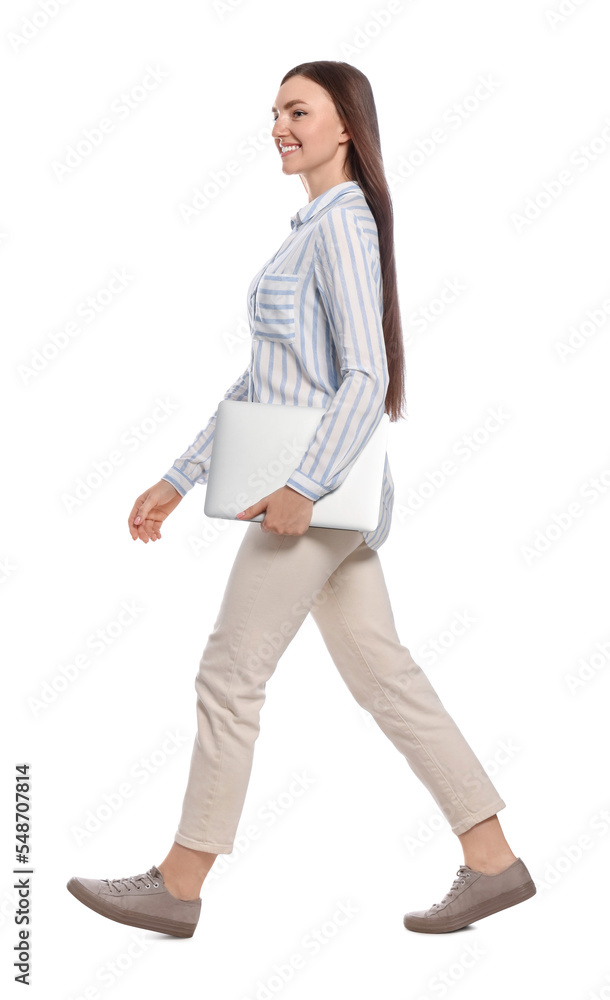 Young woman with laptop walking on white background Young woman with laptop walking on white background