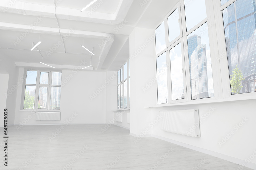 Modern office room with white walls and windows. Interior design Modern office room with white walls and windows. Interior design