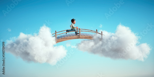 Old man running on a bridge between two clouds. Aspiration and dream big concept.