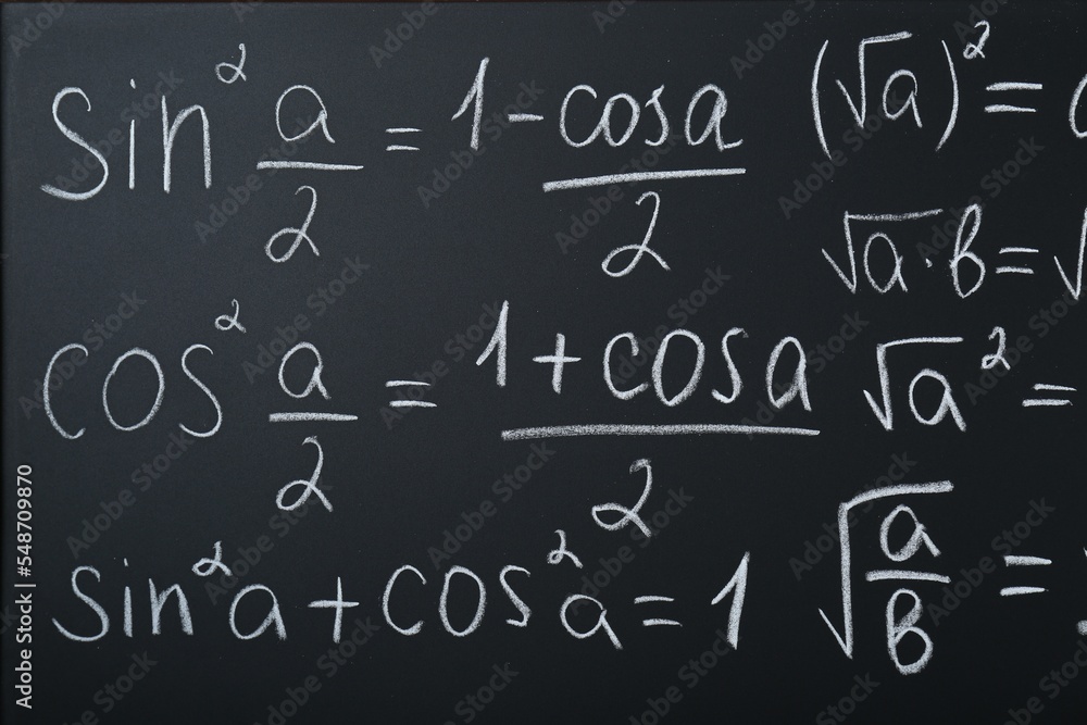 Different mathematical formulas written with chalk on blackboard Different mathematical formulas written with chalk on blackboard