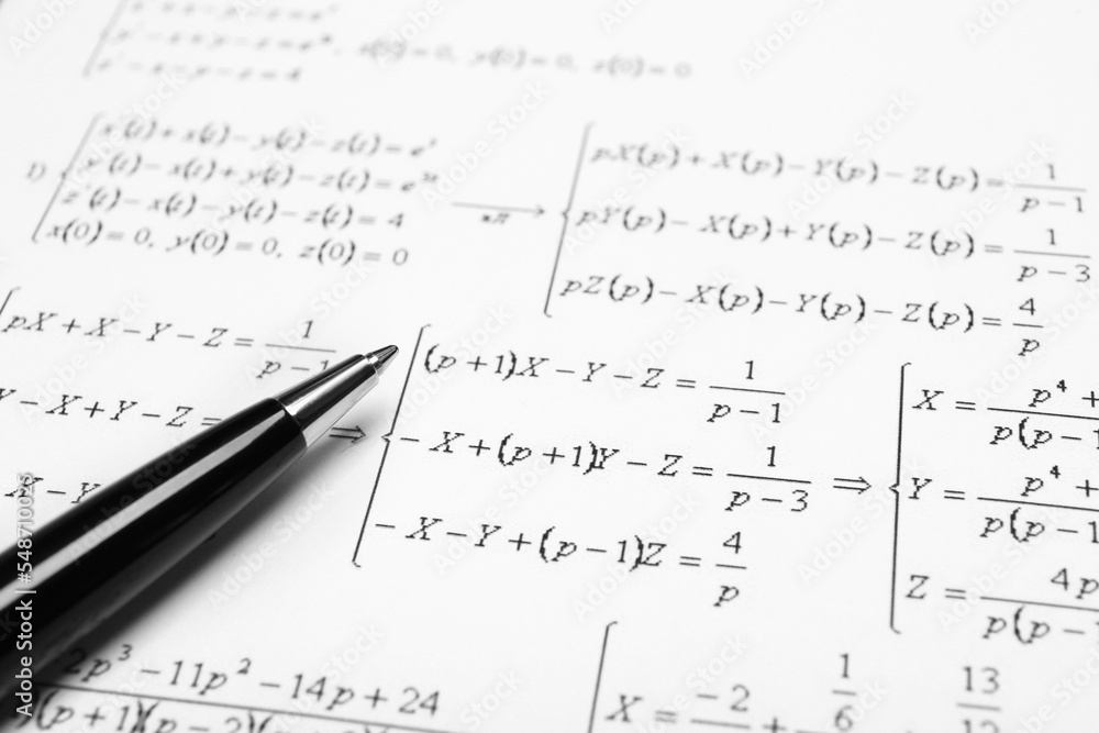 Sheet of paper with mathematical formulas and pen, closeup Sheet of paper with mathematical formulas and pen, closeup