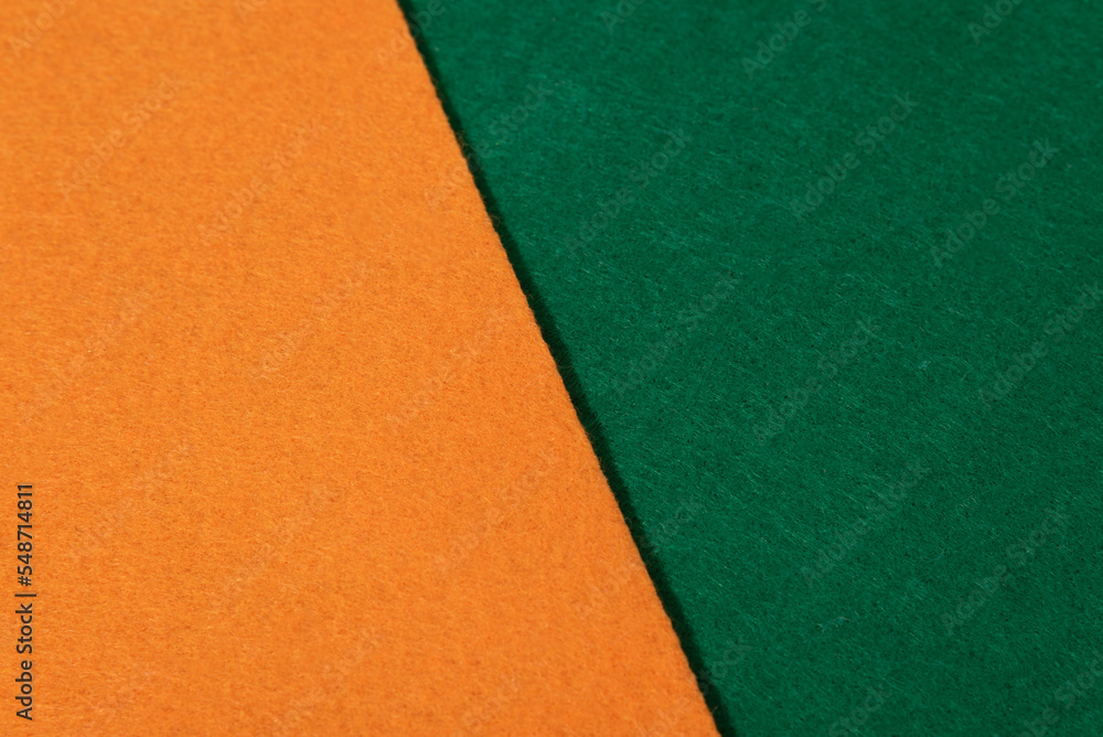 Close up orange and green felt texture Close up orange and green felt texture