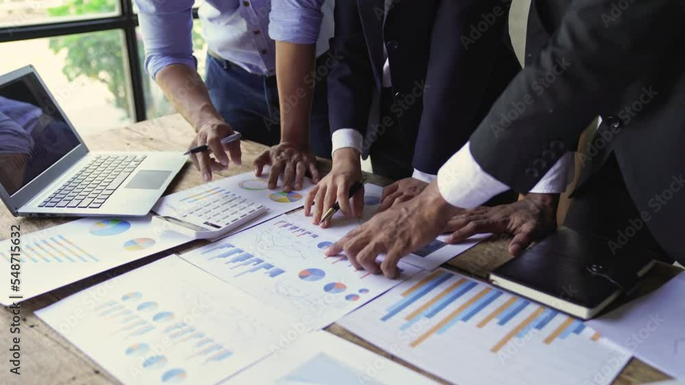 Business people discussing a financial plan, Business people meeting together about investment and the discussion graph financial information at the meeting. Business people discussing a financial plan, Business people meeting together about investment and the discussion graph financial information at the meeting.