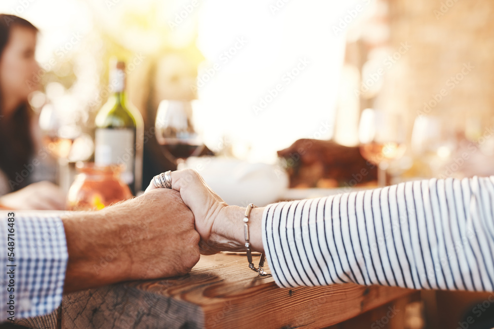 Obraz premium Family hands and praying at lunch for worship at table for thanksgiving, family lunch or gathering in a home. Food, pray and hand of people praying before sharing a meal together, respect and grace