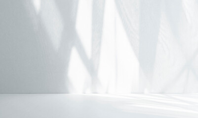 Minimalistic abstract gentle light grey background for product presentation with light and shadow of window curtains on wall.
