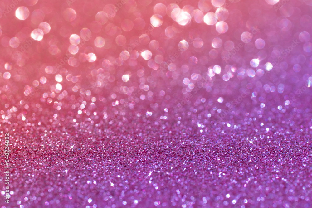 Bright sparkling glamorous background of purple and pink sequins. Abstract blurred shiny holiday background. Bright sparkling glamorous background of purple and pink sequins. Abstract blurred shiny holiday background.