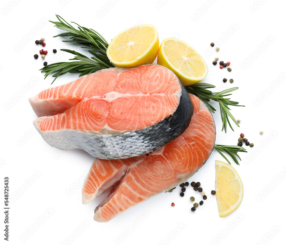 Fresh raw salmon steaks with rosemary, peppercorns and lemon on white background, top view Fresh raw salmon steaks with rosemary, peppercorns and lemon on white background, top view