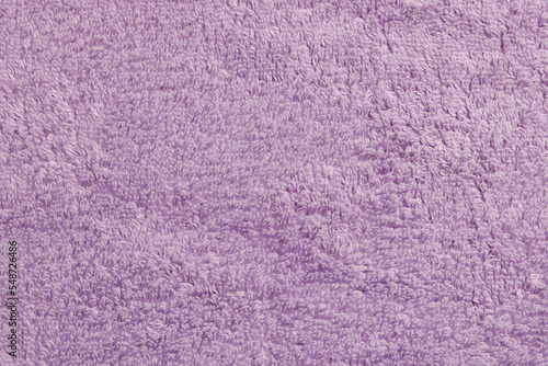Soft pale purple towel as background, top view