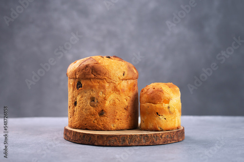 Panettone is the traditional Italian Milan sweet bread for Christmas on a gray background