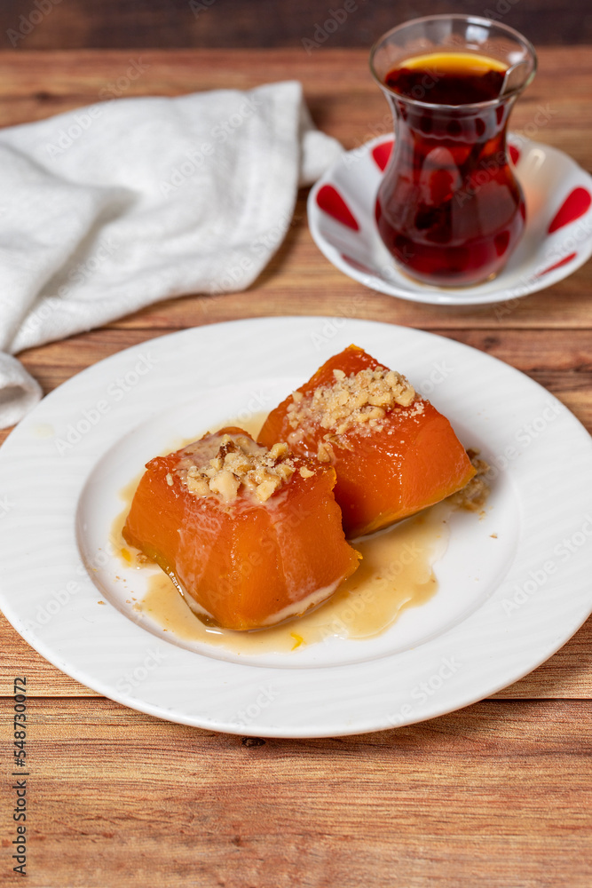 Zucchini dessert with tahini. Traditional Turkish cuisine delicacies. Local name tahinli kabak tatlisi. close up