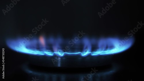 Natural Gas is burning in gas-stove in the kitchen. High gas bill problems.