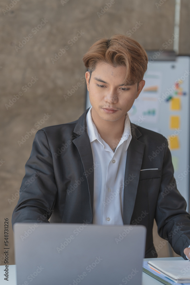 attractive Asian man working office morning, Busy man office, Young attractive businessman getting ready for work in the morning. attractive Asian man working office morning, Busy man office, Young attractive businessman getting ready for work in the morning.