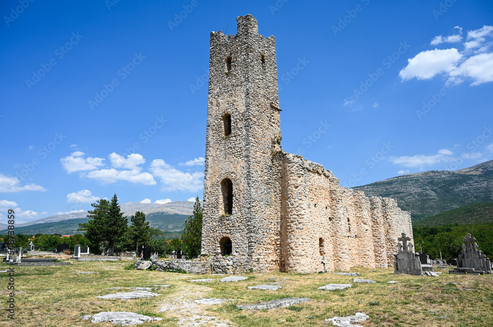 Old church and graves. Church of the Holy Salvation or Holy Saviour, village Cetina, Vrlika, Croatia. 