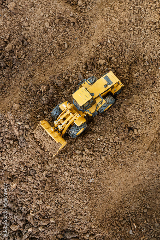 Wheel loader are digging soil in the construction site ,Top view Wheel loader are digging soil in the construction site ,Top view