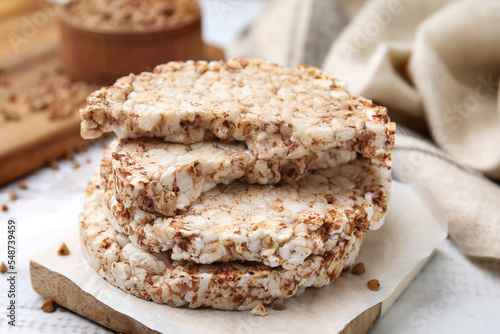 Stack of crunchy buckwheat cakes on wooden table  closeup