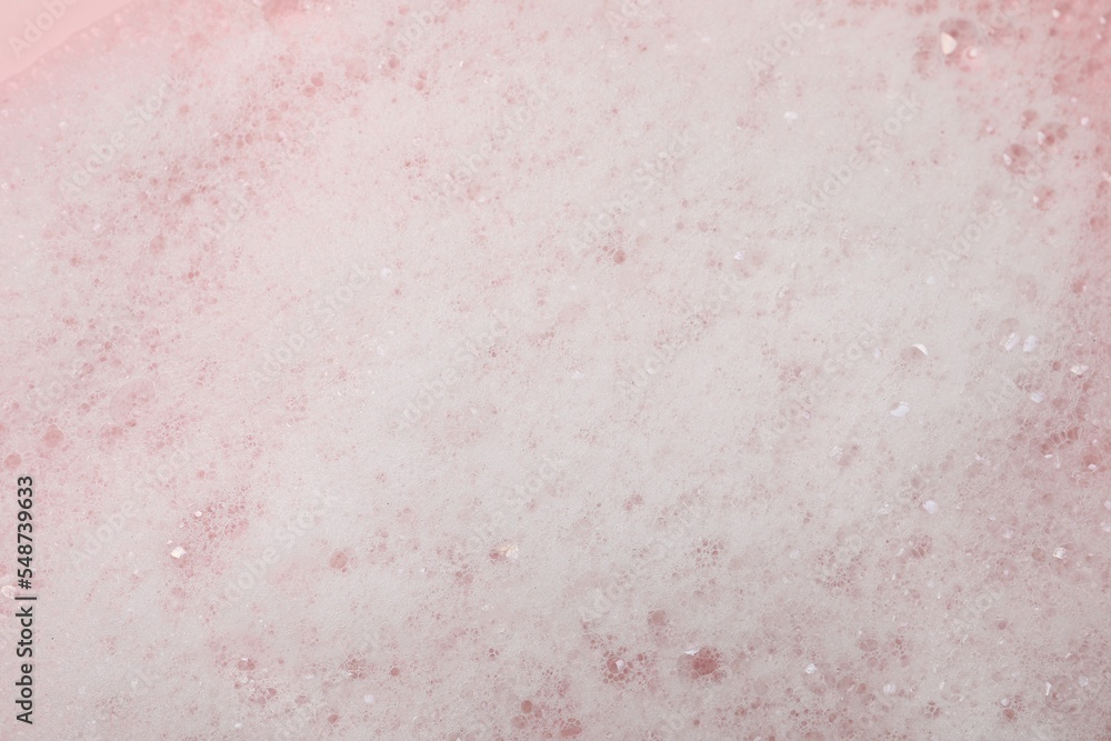 Fluffy soap foam on pink background, closeup - obrazy, fototapety, plakaty 