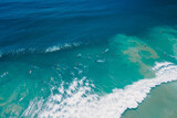 Surfers in ocean on surfboard and waves. Aerial view