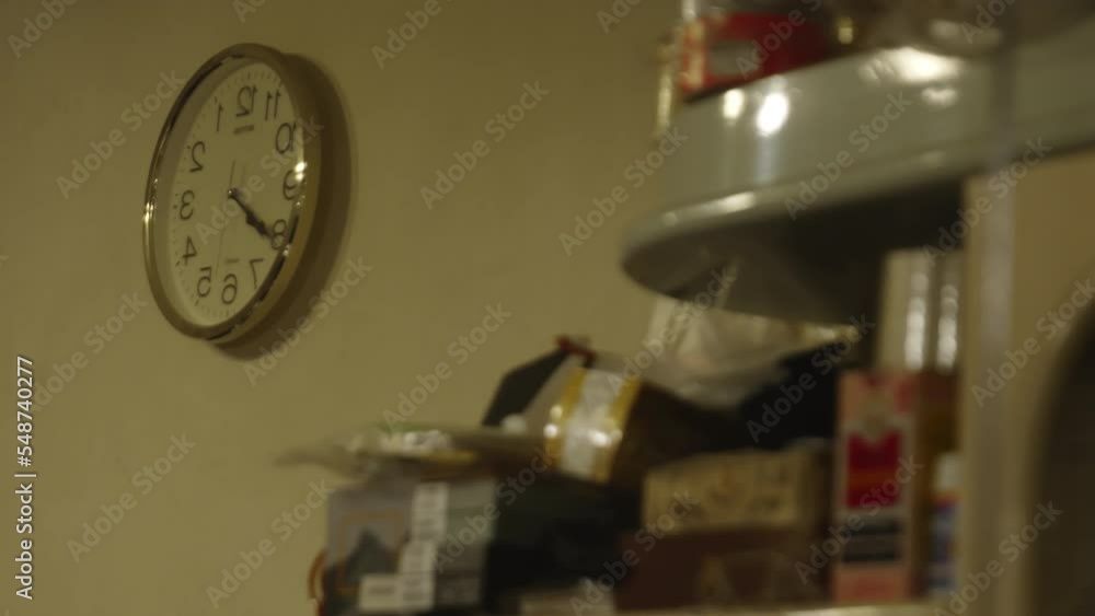 Vintage wall clock, retro items, video clock ticking, Hongkong. reverse clock.