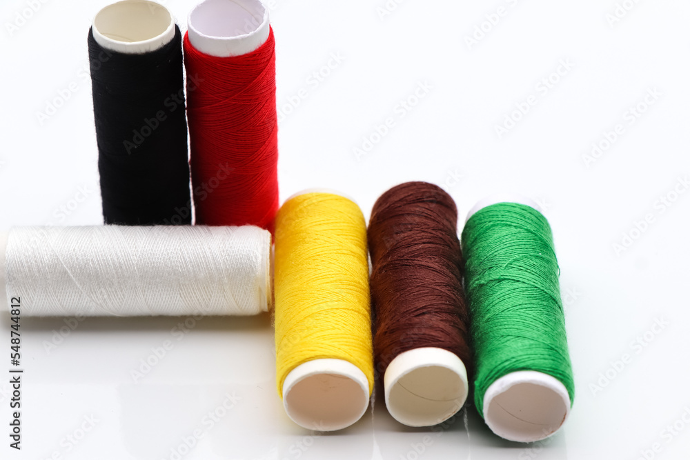 Equipment and sewing threads on white background Equipment and sewing threads on white background