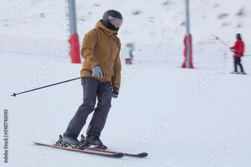 A man is skiing in the snow.