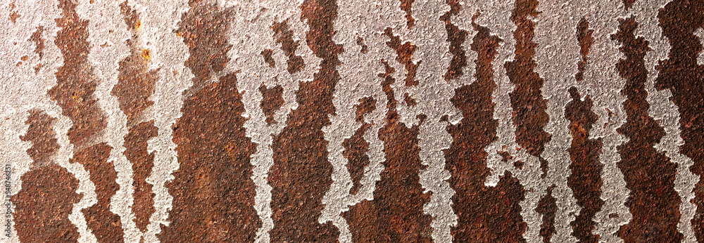 Paint on a rusty metal sheet as an abstract background. Paint on a rusty metal sheet as an abstract background.