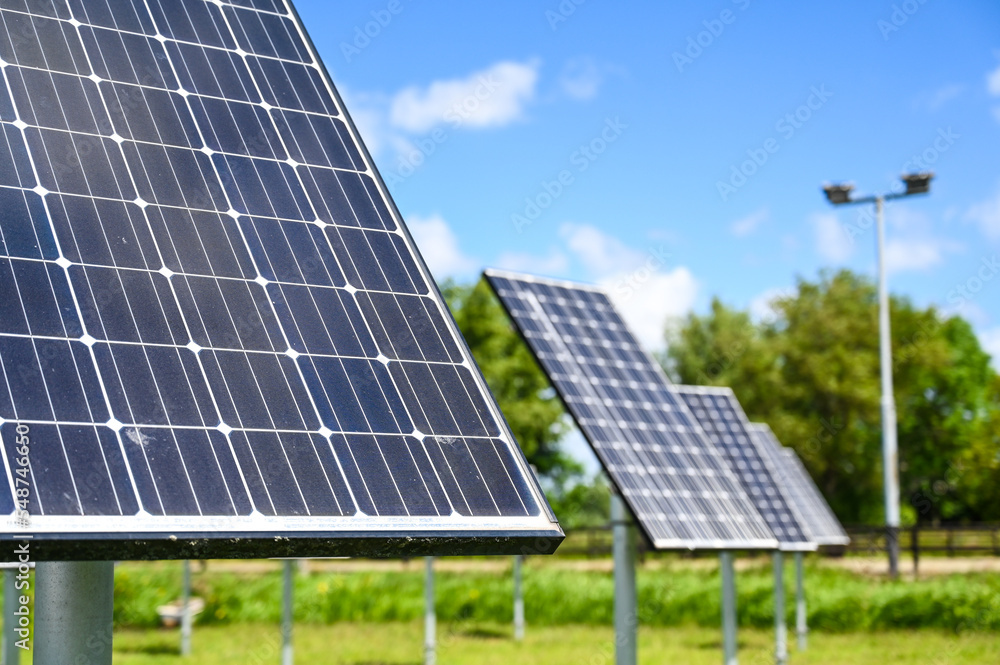 Solar cell plant. Solar energy farm. Solar panels. Producing clean renewable energy from the sun. Photovoltaic solar cells. Producing electricity. Solar cell plant. Solar energy farm. Solar panels. Producing clean renewable energy from the sun. Photovoltaic solar cells. Producing electricity.