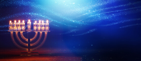 Image of jewish holiday Hanukkah with menorah (traditional candelabra) and candles