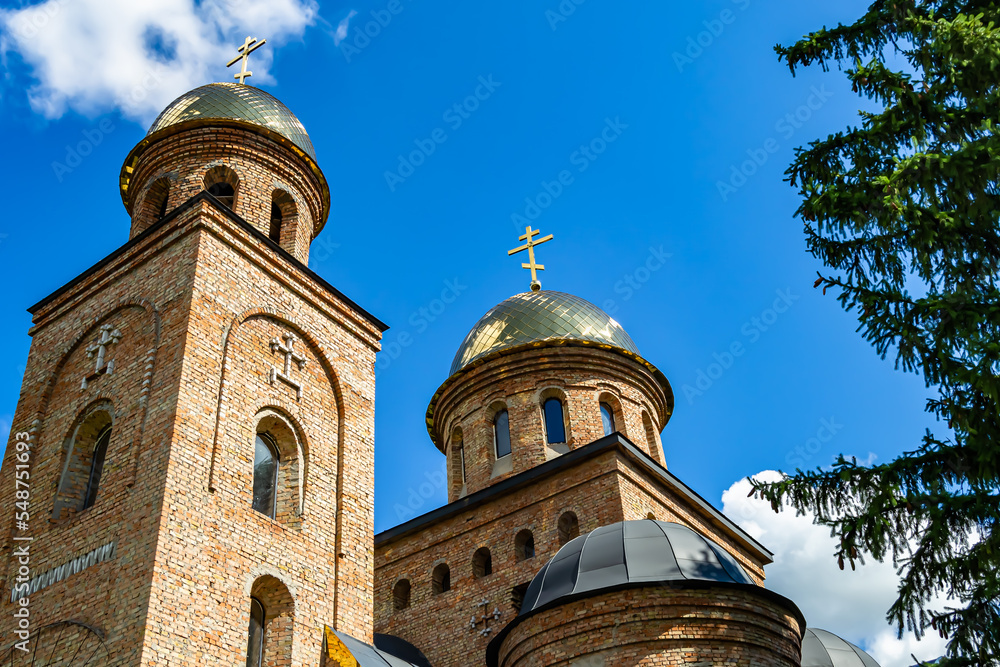 Christian church cross in high steeple tower for prayer