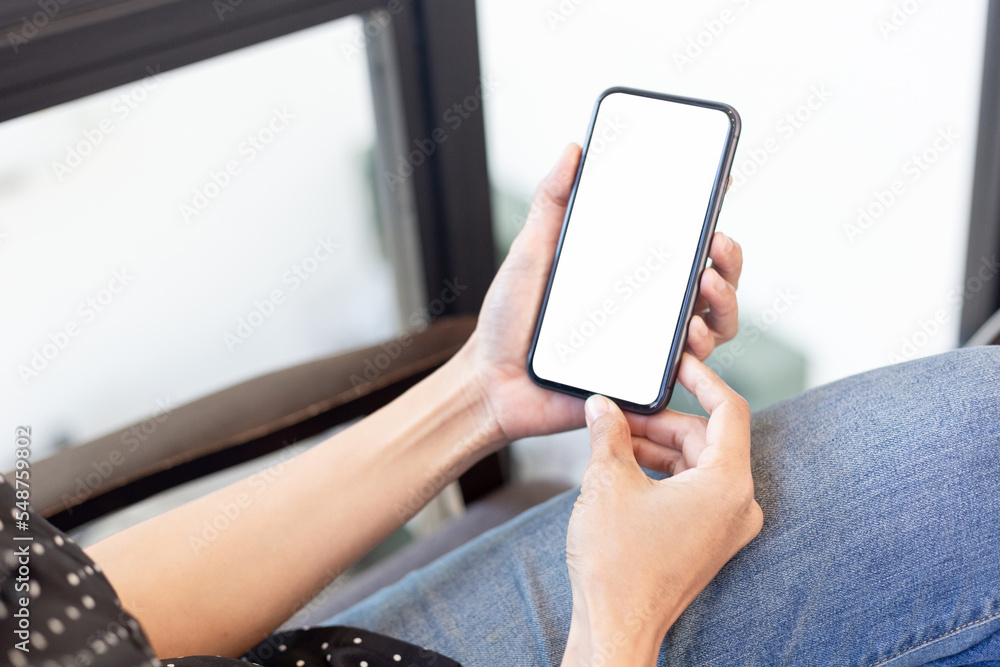 cell phone blank white screen mockup.hand holding texting using mobile on desk at office.background empty space for advertise.work people contact marketing business,technology cell phone blank white screen mockup.hand holding texting using mobile on desk at office.background empty space for advertise.work people contact marketing business,technology