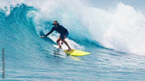 Surfing pack. Man surfs the wave in the Maldives. Four clips of the senior surfer from different angles- take off, view from water, surfing the wave, underwater view. Full length, 4k separate clips