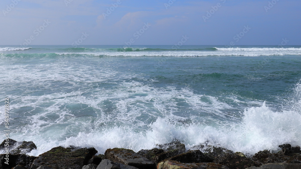 Ocean shore with sandy beach and advancing wave Ocean shore with sandy beach and advancing wave