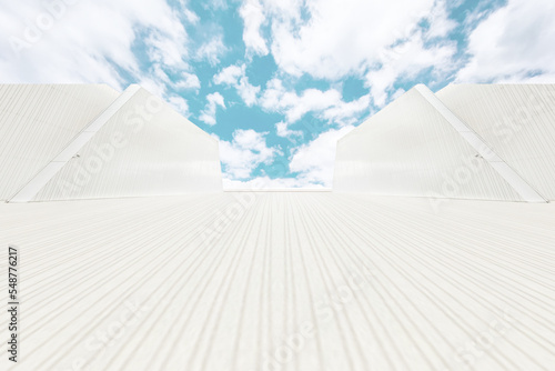 Under the blue sky, the lines extend longitudinally to the unmanned square and the symmetrical wall facade