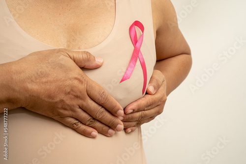 Wallpaper Mural Breast cancer, pink ribbon at Asian senior lady for supporting awareness, symbol of World Breast Cancer Day. Torontodigital.ca