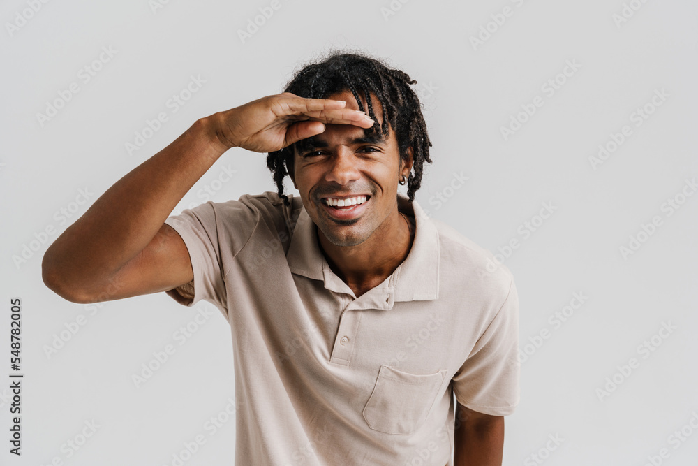 Black young man with braids gesturing and looking at camera Black young man with braids gesturing and looking at camera
