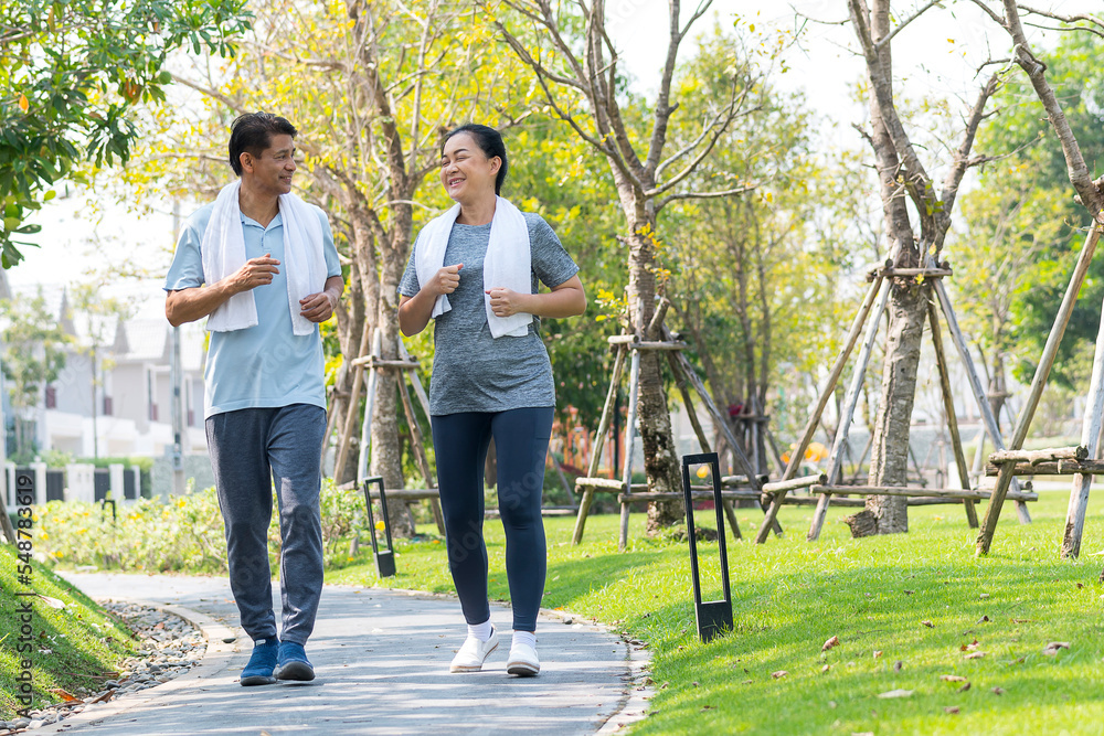 happy couple asian elder jogging running with smile in park