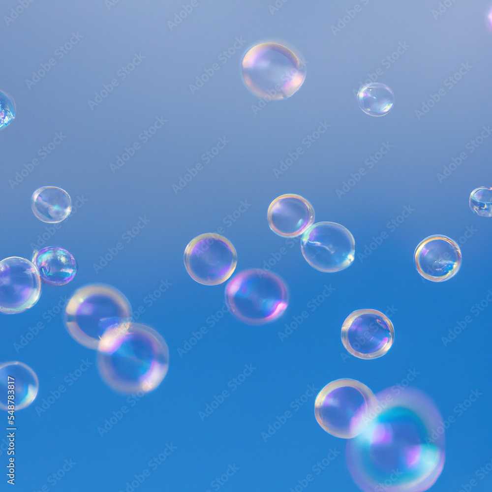 Group of colorful soap bubbles in the air in front of blue sky