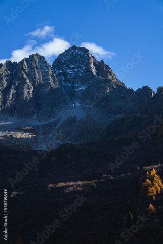The peaks of Val Camonica with the first snow  glaciers  foliage and autumn colors  near the town of Ponte di Legno  Italy - October 2022.