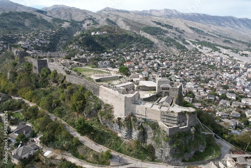 Gjirokaster castle-Clock tower, ottoman architecture in Albania, Unesco World Heritage Site, Gjirocaster ancient town, Albania,Europe, aerial panorama landscape of Gjirokastra UNESCO
 photo