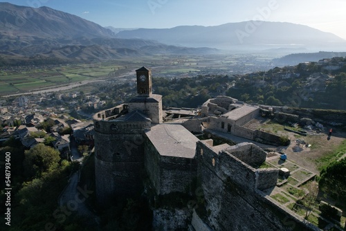 Gjirokaster castle-Clock tower, ottoman architecture in Albania, Unesco World Heritage Site, Gjirocaster ancient town, Albania,Europe, aerial panorama landscape of Gjirokastra UNESCO
 photo