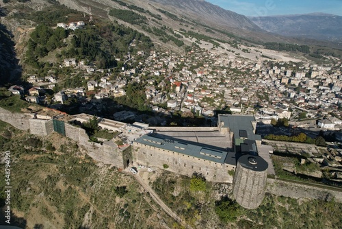 Gjirokaster castle-Clock tower, ottoman architecture in Albania, Unesco World Heritage Site, Gjirocaster ancient town, Albania,Europe, aerial panorama landscape of Gjirokastra UNESCO
 photo