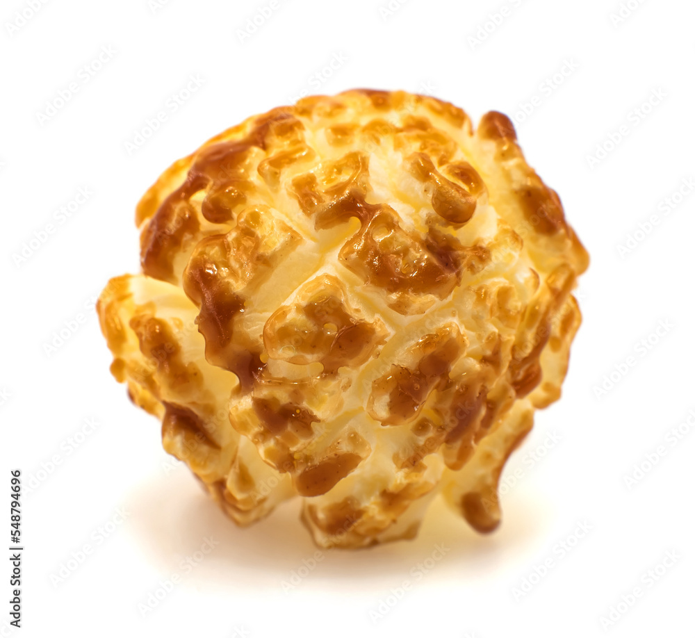 Caramel popcorn on a white background close-up. Popcorn Granule Isolate Caramel popcorn on a white background close-up. Popcorn Granule Isolate