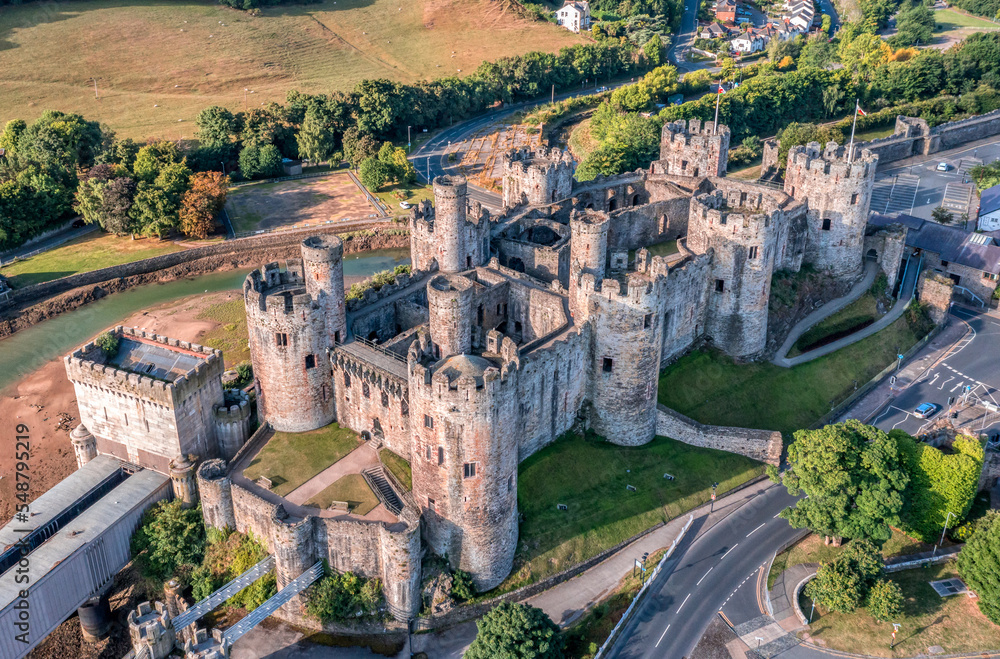 Aerial view with Conwy town and the medieval castle, the famous landmark of Wales and UK, captured in the morning