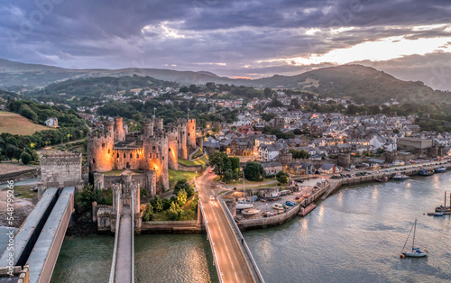 Obraz na płótnie Aerial view with Conwy town and the medieval castle, the famous landmark of Wales and UK, captured at sunset w salonie