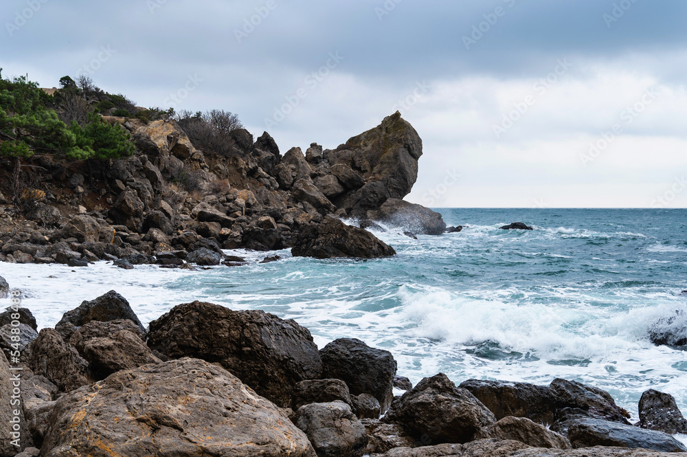 Sea waves on the rocky coast
