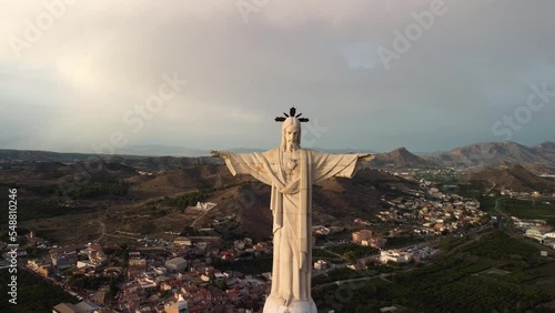Aerial view traveling out of a statue of Jesus Christ. Cristo de Monteagudo, Murcia, Spain. It begins in the heart of Christ and ends with the general plan.
