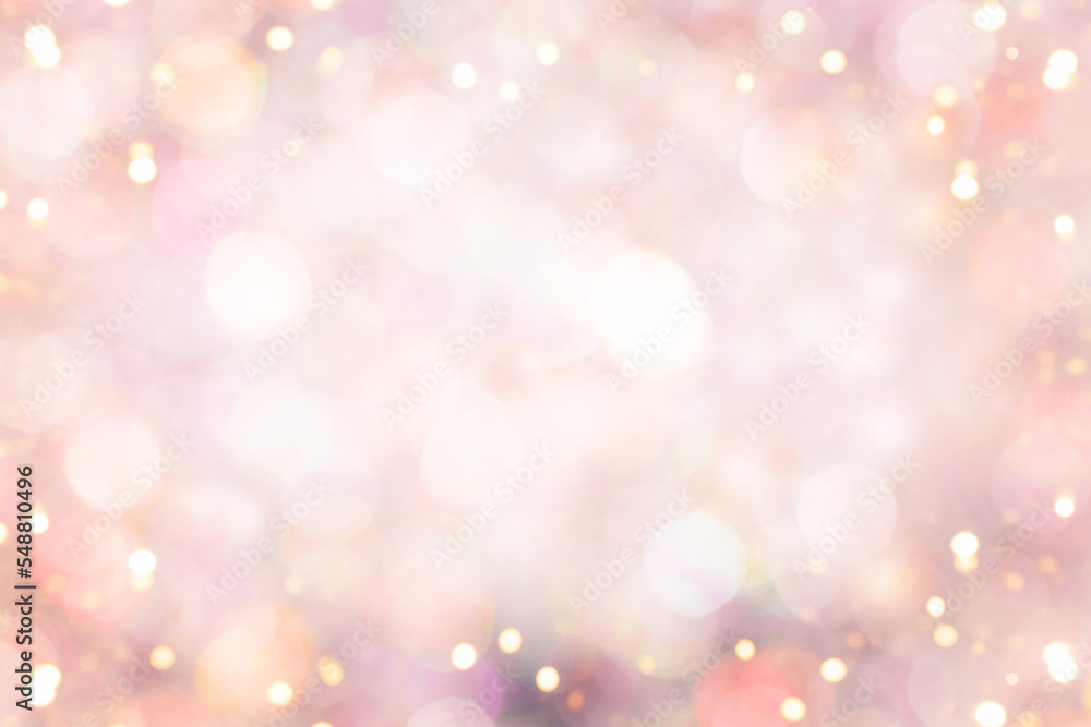 Blurred background with orange-pink holiday lights. Perfect Christmas background.